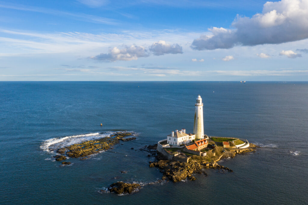 England, Tyne and Wear, Whitley Bay. Aerial view of St Mary's Lighthouse and Island and the North Sea.