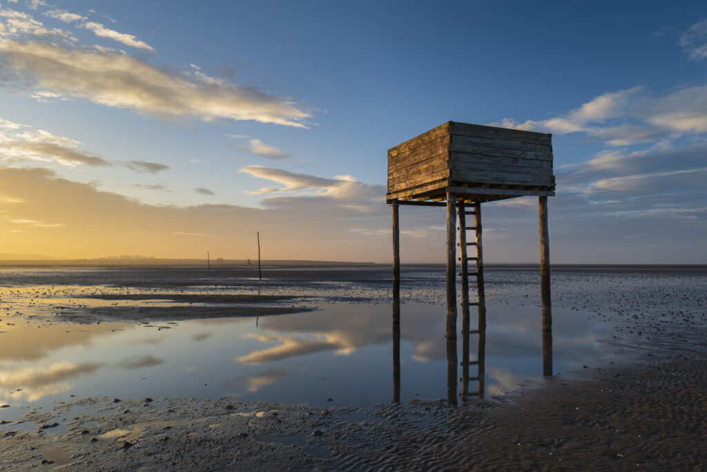 England, Northumberland, Northumberland Heritage Coast. Emergency shelter on the Pilgrim's Causeway linking the Holy Island of Lindisfarne off the Northumberland Coast with the mainland.